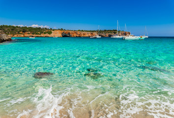 Fototapeta premium Boats anchored at sea coastline with turquoise water 