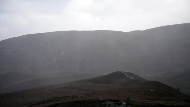 Heavy rain and wind over Cairngorm Scottish Highland hills during a storm