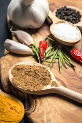 Spices on rustic wooden table. Overhead view food photography.