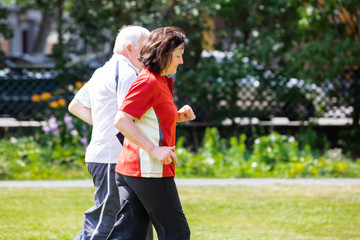 Couple Running In Park