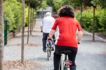 Obraz premium Couple Cycling In Park