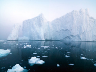 huge icebergrs are on the arctic ocean at Greenland