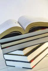 stack of books and opened book