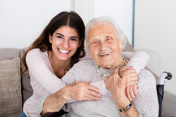 Two Women Embracing Each Other At Home