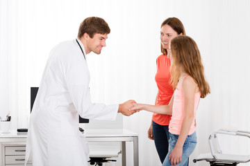 Doctor Handshaking Girl