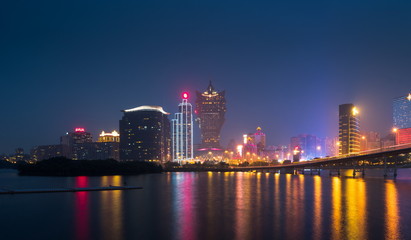Naklejka na ściany i meble Skyline of Macau city at Nam Van Lake, China. The city maintains the world's highest gambling revenue with over 20 million tourists annually.