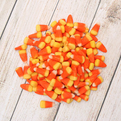 Candy Corn isolated on a Light Wood Table