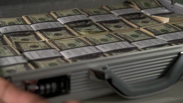 man lays down the money, passports and a gun in case