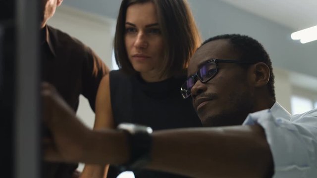 Serious colleagues working on new business ideas.