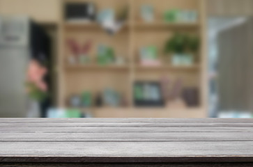 Selected focus empty brown wooden table and Coffee shop blur bac