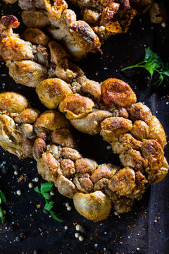 Roasted chunchules. Typical Latin American Chilean and argentina food.