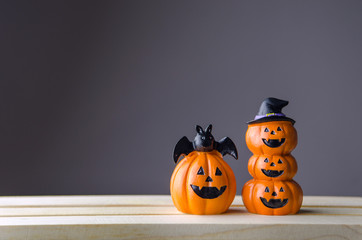 Happy Halloween, Two Pumpkin on table wood with gray wall background, halloween concept. Copy space.