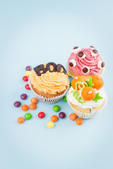 Halloween cupcakes with colored decorations