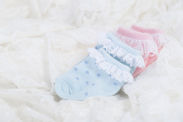 baby socks for new born baby on Wedding lace background