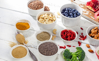 Super foods on a white wooden table.