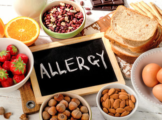 Allergic food on  wooden background.