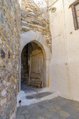 Traditional narrow street in Chora Naxos, Cyclades, Greece.