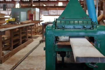 Fototapeta na wymiar Planing of wood machine in workshop