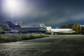 Fototapeta na wymiar Planes maintenance on the aviation technical base at night