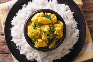 Chicken Korma on a mildly spiced creamy sauce close-up. horizontal top view
