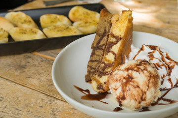 Soft cake with ice cream  on wood background