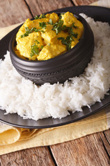 Chicken Korma of coconut and cream sauce served in a rice. Vertical
