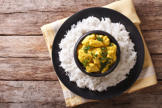 Chicken Korma of coconut and cream sauce served in a rice. horizontal top view
