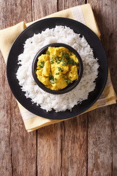 Chicken Korma of coconut and cream sauce served in a rice. Vertical top view