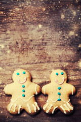 Christmas homemade gingerbread cookies over wooden table. Christ