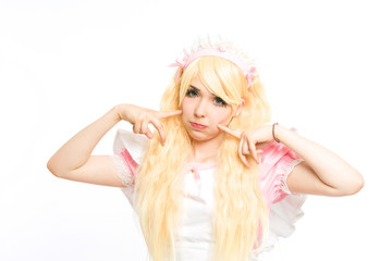 Obraz na płótnie Canvas characterized maid manga girl makeup gesticulating in the studio