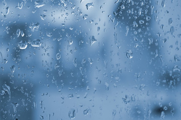 Naklejka na ściany i meble Rain drops on glass,Drops on glass background