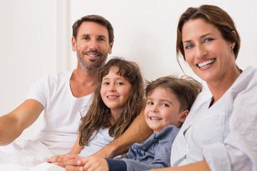 Smiling parents with children