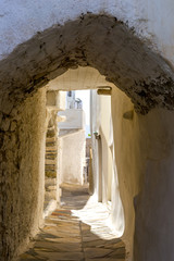 Traditional narrow street in Chora town, Naxos Island, Cyclades, - obrazy, fototapety, plakaty