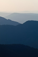 Naklejka premium Distant mountains at dusk