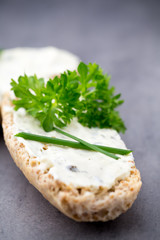 Crispbread with soft cheese with herbs and bacon.