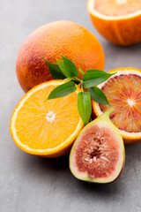 Bloody Sicilian oranges and figs. Shallow depth of field.