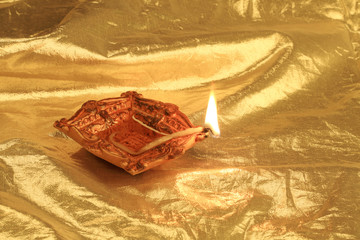 Golden Diwali - Handmade Diya in gold color background