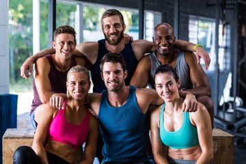 Cheerful multi-ethnic friends in gym