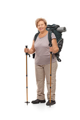 Mature female hiker posing with hiking equipment