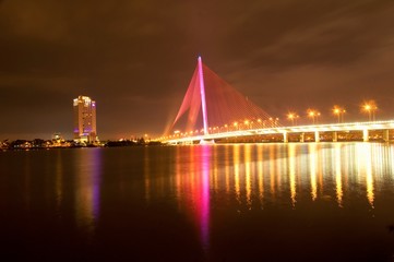 Fototapeta na wymiar Tran Thi Ly bridge at night in Da Nang city, Vietnam
