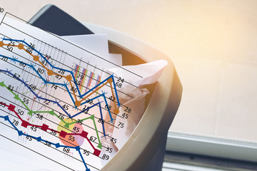 The Graph of business report in the trash