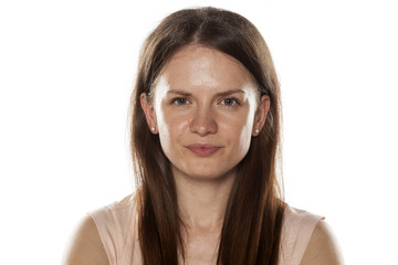 Portrait of a smiling young woman without makeup