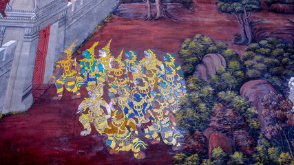 Masterpiece of traditional Thai style painting art old (1931) of Ramayana story on the temple wall of famous Wat Phra Kaew in Bangkok, Thailand..Photo taken on: Oct 6th, 2016 © iphotothailand