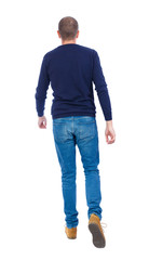 Back view of going  handsome man. walking young guy . Rear view people collection.  backside view of person.  Isolated over white background. Man in warm jacket goes away.