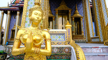 Golden angel statue of the Emerald Buddha temple(Wat phra kaew) and Royal Grand Palace ,Bangkok,Thailand.
