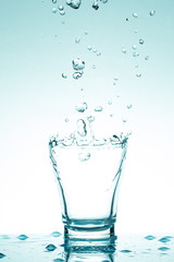 water splash in glasses isolated on white