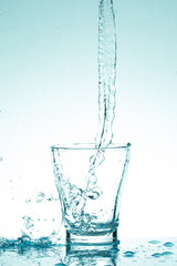 water splash in glasses isolated on white