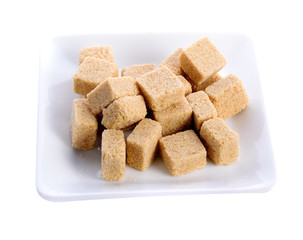 sugar cube in white plate on white background