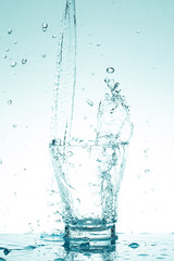 Naklejka na ściany i meble water splash in glasses isolated on white