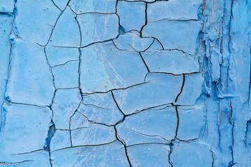Cracked blue paint as background or texture